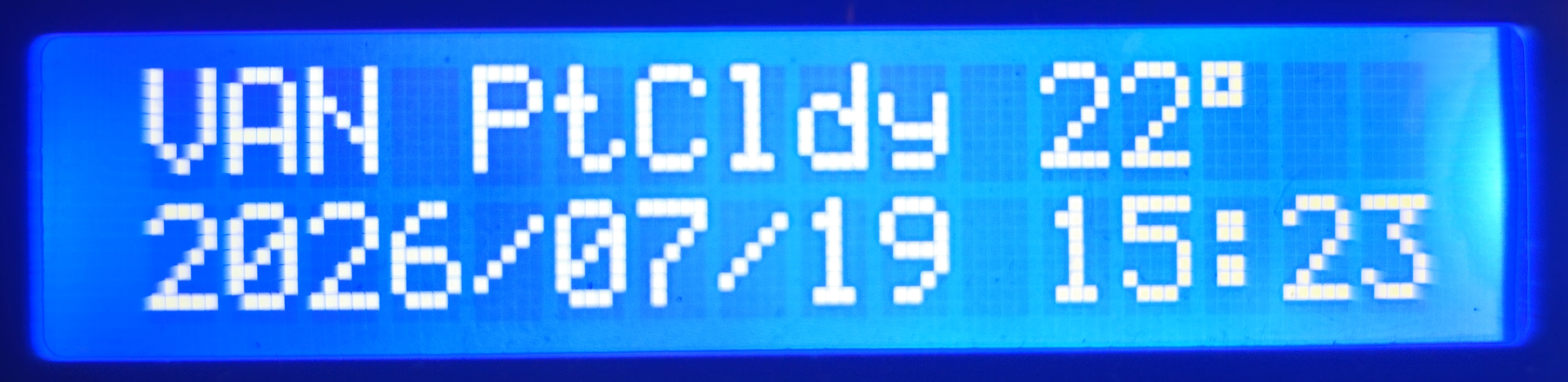 LCD clock view for Vancouver: partly cloudy, 22 degrees, with the time shown in Pacific time